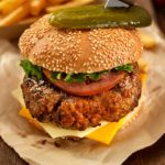 fried chicken burger sauced poured